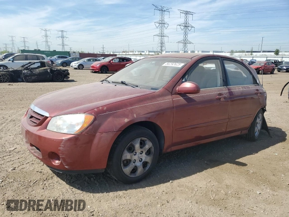 2005 Kia Spectra LX z VIN KNAFE121355162932, wystawiony jako Copart lot #56292625 z przebiegiem 92 828 mil mil oraz Szkoda całkowita • Salvage title. Historia ofert i sprzedaży dostępna na DreamBid. Obrazek 1.