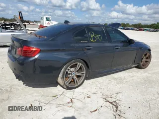 2014 BMW M5 with VIN WBSFV9C54ED097865, listed as a Copart auction lot 79897384 with 0 mi miles and Salvage Title. Bid and sale history available at carsss.com. Image 3.
