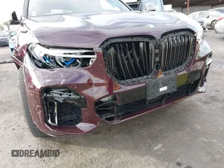 2021 BMW X5 M50i with VIN 5UXJU4C04M9G03418, listed as a IAAI auction lot 40705167 with 24,073 mi miles and . Bid and sale history available at DreamBid. Image 6.