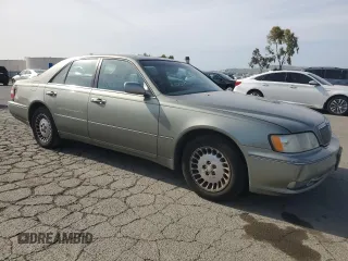 2001 Infiniti Q45 Touring with VIN JNKBY31A01M101364, listed as a Copart auction lot 54859845 with 213,588 mi miles and Salvage Title. Bid and sale history available at DreamBid. Image 4.