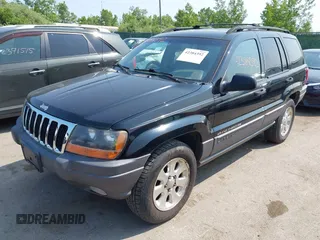 2001 Jeep Grand Cherokee Laredo with VIN 1J4GW48S31C558946, listed as a IAAI auction lot 42384392 with 252,393 mi miles and . Bid and sale history available at DreamBid. Image 2.