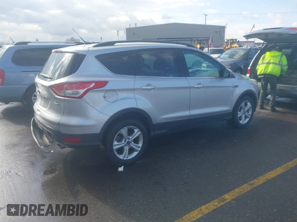 2014 Ford Escape SE with VIN 1FMCU9GX9EUB98758, listed as a IAAI auction lot 41717257 with 126,358 mi miles. Bid and sale history available at carsss.com. Image 4.