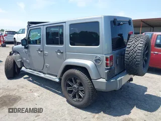 2013 Jeep Wrangler Unlimited Sahara with VIN 1C4BJWEG4DL666930, listed as a IAAI auction lot 42310569 with 206,577 mi miles and . Bid and sale history available at DreamBid. Image 3.