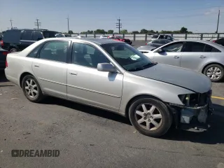2000 Toyota Avalon XL with VIN 4T1BF28B7YU112576, listed as a Copart auction lot 59726505 with 242,412 mi miles and Salvage title. Bid and sale history available at DreamBid. Image 4.