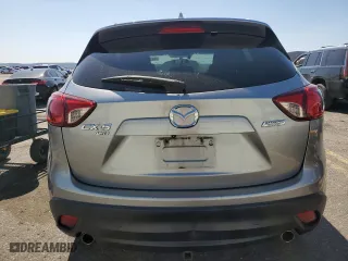 2014 Mazda CX-5 Grand Touring with VIN JM3KE4DY4E0305212, listed as a Copart auction lot 53145305 with 233,061 mi miles and Salvage Title. Bid and sale history available at carsss.com. Image 6.