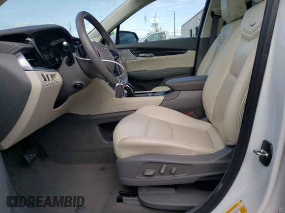 2023 Cadillac XT6 FWD Premium Luxury with VIN 1GYKPCRS5PZ120161, listed as a Copart auction lot 54614235 with 39,700 mi miles and Salvage title. Bid and sale history available at DreamBid. Image 7.