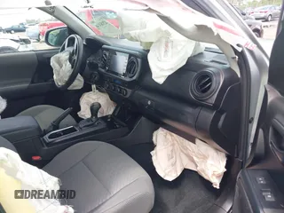 2023 Toyota Tacoma SR with VIN 3TYCZ5AN4PT149730, listed as a IAAI auction lot 42083146 with 31,731 mi miles and . Bid and sale history available at DreamBid. Image 5.