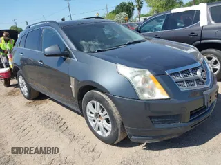 2012 Cadillac SRX with VIN 3GYFNGE32CS546815, listed as a IAAI auction lot 42014765 with 142,373 mi miles. Bid and sale history available at carsss.com. Image 1.