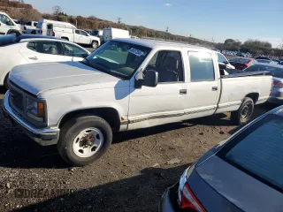 1999 GMC Sierra 1500 with VIN 1GTGC33RXXF096504, listed as a Copart auction lot 80027354 with 124,430 mi miles and Clean Title. Bid and sale history available at DreamBid. Image 1.