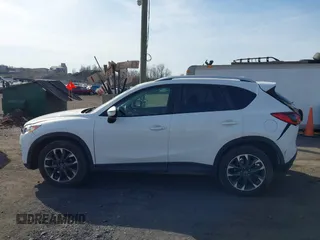 2016 Mazda CX-5 Grand Touring with VIN JM3KE4DYXG0836692, listed as a IAAI auction lot 41812584 with 119,302 mi miles. Bid and sale history available at carsss.com. Image 14.