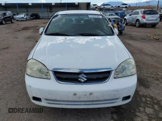 2006 Suzuki Forenza z VIN KL5JD56Z86K350488, wystawiony jako Copart lot #67422784 z przebiegiem 125 251 mil mil oraz Tytuł czysty. Historia ofert i sprzedaży dostępna na DreamBid. Obrazek 5.