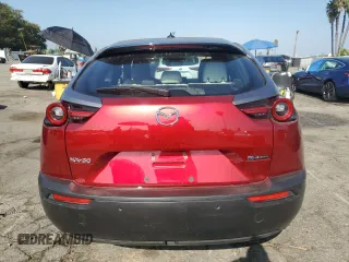 2022 Mazda MX-30 Premium Plus Package with VIN JM1DRADB7N0100256, listed as a Copart auction lot 69304084 with 11,057 mi miles and Salvage Title. Bid and sale history available at carsss.com. Image 6.