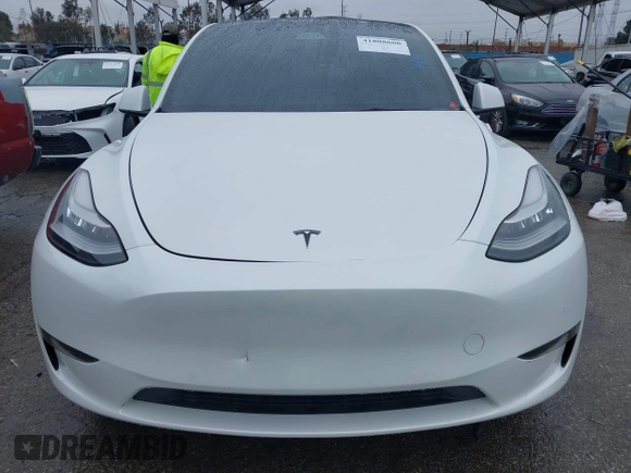 2021 Tesla Model Y Long Range with VIN 5YJYGAEE2MF260142, listed as a IAAI auction lot 41808666 with 87,316 mi miles and . Bid and sale history available at DreamBid. Image 11.