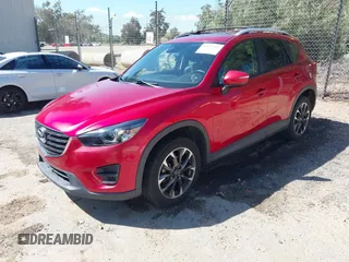 2016 Mazda CX-5 Grand Touring with VIN JM3KE2DY3G0686588, listed as a IAAI auction lot 41697312 with 65,090 mi miles. Bid and sale history available at carsss.com. Image 17.