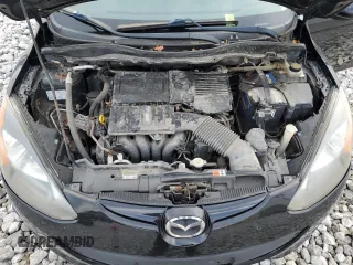 2011 Mazda 2 Touring z VIN JM1DE1HY2B0114734, wystawiony jako Copart lot #86430934 z przebiegiem 123 265 mil mil oraz Czysty tytuł • Clean title. Historia ofert i sprzedaży dostępna na DreamBid. Obrazek 11.