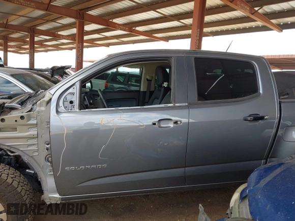 2021 Chevrolet Colorado 4WD Z71 z VIN 1GCGTDEN1M1168618, wystawiony jako IAAI lot #41683565 z przebiegiem 57 697 mil mil oraz . Historia ofert i sprzedaży dostępna na DreamBid. Obrazek 15.