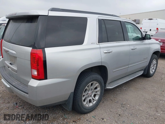 2015 GMC Yukon SLT z VIN 1GKS1BKC0FR172661, wystawiony jako IAAI lot #41911331 z przebiegiem 171 815 mil mil oraz . Historia ofert i sprzedaży dostępna na DreamBid. Obrazek 4.