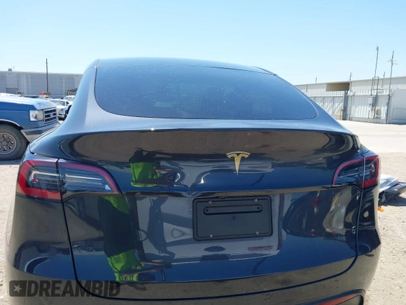 2024 Tesla Model Y with VIN 7SAYGDED2RF040745, listed as a IAAI auction lot 41986613 with 9,778 mi miles and . Bid and sale history available at DreamBid. Image 16.