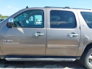 2011 Chevrolet Suburban LT with VIN 1GNSCJE03BR396610, listed as a IAAI auction lot 42348029 with 249,280 mi miles and . Bid and sale history available at DreamBid. Image 14.