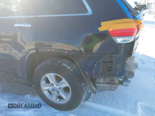 2014 Jeep Grand Cherokee Overland with VIN 1C4RJFCG1EC200570, listed as a IAAI auction lot 41301398 with 183,986 mi miles. Bid and sale history available at carsss.com. Image 22.