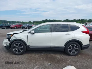 2018 Honda CR-V Touring with VIN 2HKRW2H91JH665241, listed as a IAAI auction lot 42638694 with 62,066 mi miles and . Bid and sale history available at DreamBid. Image 14.