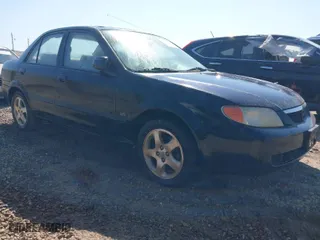 2001 Mazda Protege LX with VIN JM1BJ225410469975, listed as a IAAI auction lot 42035389 with 252,022 mi miles. Bid and sale history available at carsss.com. Image 1.
