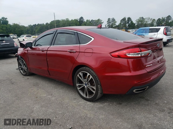 2019 Ford Fusion Titanium z VIN 3FA6P0D99KR221328, wystawiony jako Copart lot #57104515 z przebiegiem 138 427 mil mil oraz Szkoda całkowita • Salvage title. Historia ofert i sprzedaży dostępna na DreamBid. Obrazek 2.