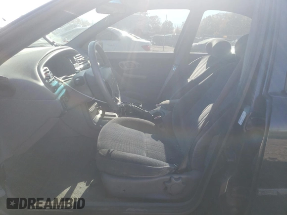 1996 Ford Contour z VIN 1FALP65L5TK212857, wystawiony jako Copart lot #76701614 z przebiegiem 74 994 mil mil oraz Szkody całkowita. Historia ofert i sprzedaży dostępna na DreamBid. Obrazek 7.
