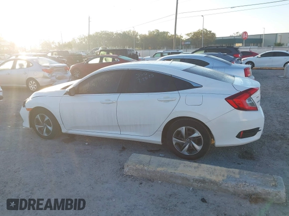 2019 Honda Civic LX with VIN 19XFC2F61KE014007, listed as a IAAI auction lot 41795070 with 64,259 mi miles and . Bid and sale history available at DreamBid. Image 14.