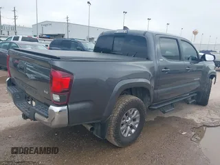 2018 Toyota Tacoma SR5 with VIN 5TFAZ5CN5JX062498, listed as a IAAI auction lot 41867393 with 128,879 mi miles and . Bid and sale history available at DreamBid. Image 4.