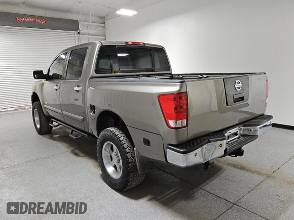 2006 Nissan Titan LE z VIN 1N6AA07BX6N573134, wystawiony jako Copart lot #46487815 z przebiegiem 161 174 mil mil oraz Czysty tytuł • Clean title. Historia ofert i sprzedaży dostępna na DreamBid. Obrazek 2.
