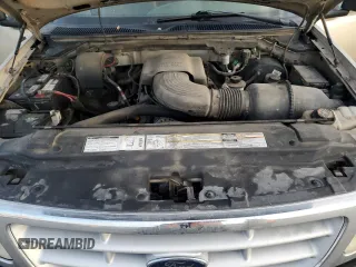 1999 Ford F-150 z VIN 2FTRX18W3XCA06671, wystawiony jako Copart lot #85561784 z przebiegiem 100 579 mil mil oraz Szkoda całkowita • Salvage title. Historia ofert i sprzedaży dostępna na DreamBid. Obrazek 12.