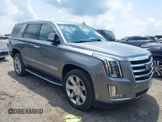 2020 Cadillac Escalade Luxury z VIN 1GYS3BKJ0LR116410, wystawiony jako IAAI lot #42274841 z przebiegiem 75 513 mil mil oraz . Historia ofert i sprzedaży dostępna na DreamBid. Obrazek 1.