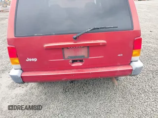 1999 Jeep Cherokee Sport with VIN 1J4FT68S1XL596443, listed as a IAAI auction lot 41767289 with 192,826 mi miles and . Bid and sale history available at DreamBid. Image 6.