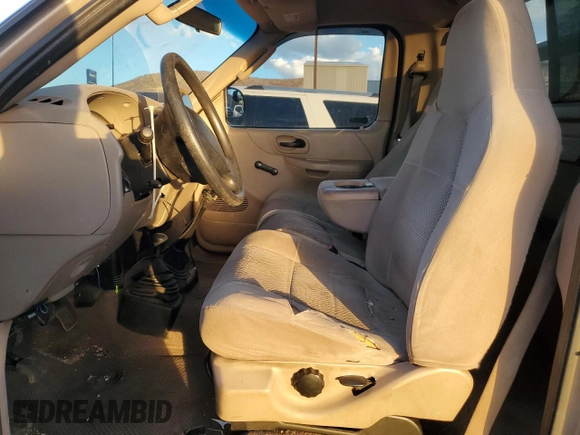 2002 Ford F-150 XL with VIN 1FTRF18262NB35586, listed as a Copart auction lot 77114114 with 166,942 mi miles and Salvage title. Bid and sale history available at DreamBid. Image 7.