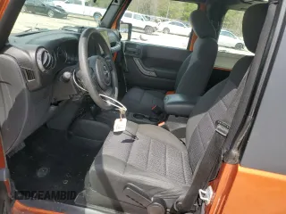 2011 Jeep Wrangler Sport with VIN 1J4AA2D15BL574234, listed as a Copart auction lot 52952605 with 114,642 mi miles and Salvage Title. Bid and sale history available at carsss.com. Image 7.