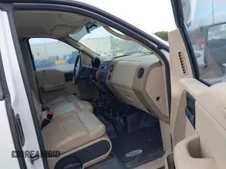 2005 Ford F-150 XL with VIN 1FTRF14W35NB42167, listed as a IAAI auction lot 41990938 with 256,964 mi miles. Bid and sale history available at carsss.com. Image 5.