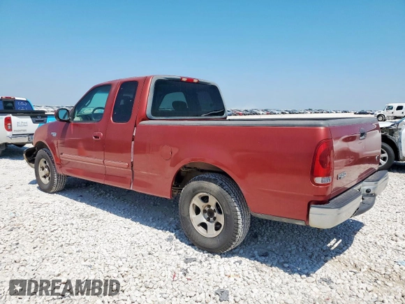 2002 Ford F-150 XL with VIN 1FTRX17202NA40522, listed as a Copart auction lot 58208915 with 100,297 mi miles and Salvage title. Bid and sale history available at DreamBid. Image 2.