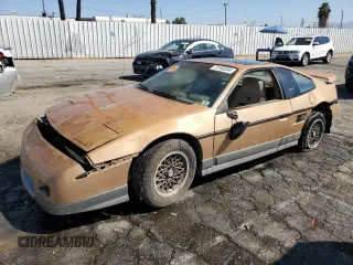 1987 Pontiac Fiero GT z VIN 1G2PG1194HP216891, wystawiony jako Copart lot #72103234 z przebiegiem 55 013 mil mil oraz Tytuł czysty. Historia ofert i sprzedaży dostępna na DreamBid. Obrazek 1.