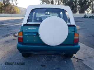 1995 Suzuki Sidekick z VIN 2S3TA02C3S6414337, wystawiony jako Copart lot #86304134 z przebiegiem 104 889 mil mil oraz Szkody całkowita. Historia ofert i sprzedaży dostępna na DreamBid. Obrazek 6.