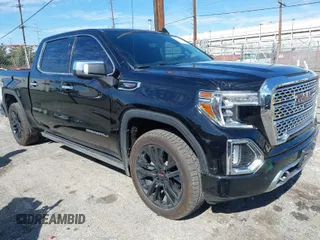 2021 GMC Sierra 1500 Denali z VIN 1GTU9FET2MZ251830, wystawiony jako IAAI lot #41624338 z przebiegiem 64 414 mil mil oraz . Historia ofert i sprzedaży dostępna na DreamBid. Obrazek 1.