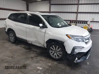 2021 Honda Pilot EX-L with VIN 5FNYF5H57MB022843, listed as a IAAI auction lot 41186957 with 57,836 mi miles. Bid and sale history available at carsss.com. Image 1.