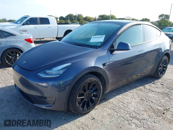 2023 Tesla Model Y Long Range z VIN 7SAYGDEE5PA099226, wystawiony jako IAAI lot #42004061 z przebiegiem 10 607 mil mil oraz . Historia ofert i sprzedaży dostępna na DreamBid. Obrazek 2.