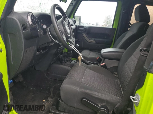 2012 Jeep Wrangler Sport with VIN 1C4AJWAG2CL233722, listed as a Copart auction lot 61125095 with 49,864 mi miles and Salvage title. Bid and sale history available at DreamBid. Image 7.