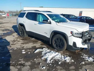 2021 GMC Acadia AT4 with VIN 1GKKNLLS5MZ124120, listed as a IAAI auction lot 41260497 with 50,672 mi miles. Bid and sale history available at carsss.com. Image 1.