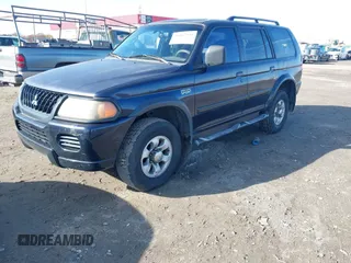 2002 Mitsubishi Montero Sport ES with VIN JA4LS21H72J054989, listed as a IAAI auction lot 41067504 with 335,479 mi miles. Bid and sale history available at carsss.com. Image 2.