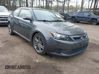 2012 Scion tC with VIN JTKJF5C7XC3031406, listed as a IAAI auction lot 41947478 with 150,762 mi miles. Bid and sale history available at carsss.com. Image 1.