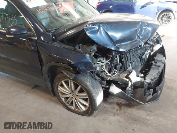 2011 Volkswagen Tiguan SE with VIN WVGBV7AXXBW533872, listed as a IAAI auction lot 40197835 with 104,685 mi miles and . Bid and sale history available at DreamBid. Image 6.