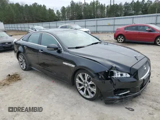 2015 Jaguar XJ with VIN SAJWA1CZ1F8V85402, listed as a Copart auction lot 86717734 with 201,249 mi miles and Salvage Title. Bid and sale history available at carsss.com. Image 4.