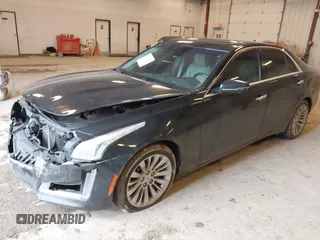 2014 Cadillac CTS Luxury AWD with VIN 1G6AX5SX2E0195357, listed as a IAAI auction lot 41677831 with 152,567 mi miles and . Bid and sale history available at DreamBid. Image 2.
